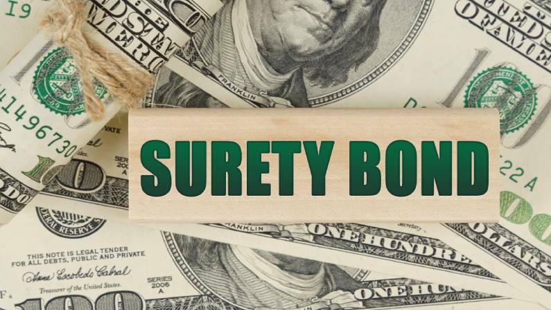 On the dollars is a wooden plate with the inscription - SURETY BOND