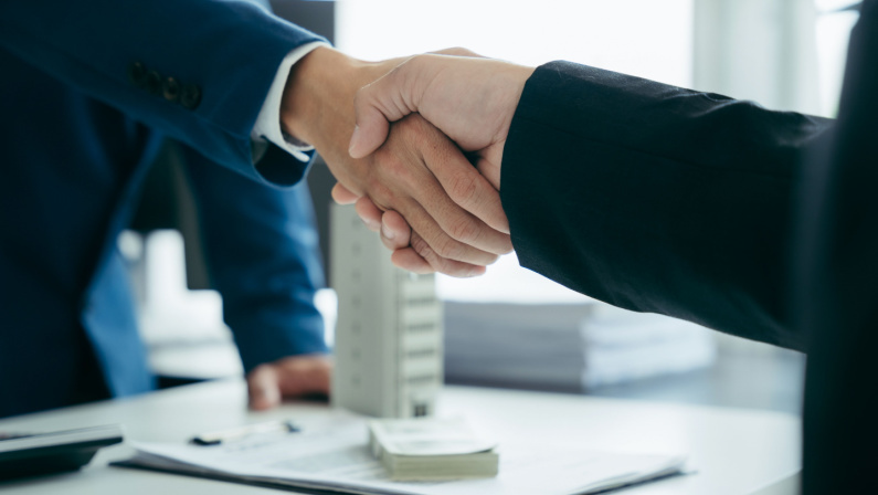 shake hands at business meeting, office negotiations. Making deal sign, conclude contract, reach agreement, formal greeting, strike bargain. Successful negotiations, insurance concept.